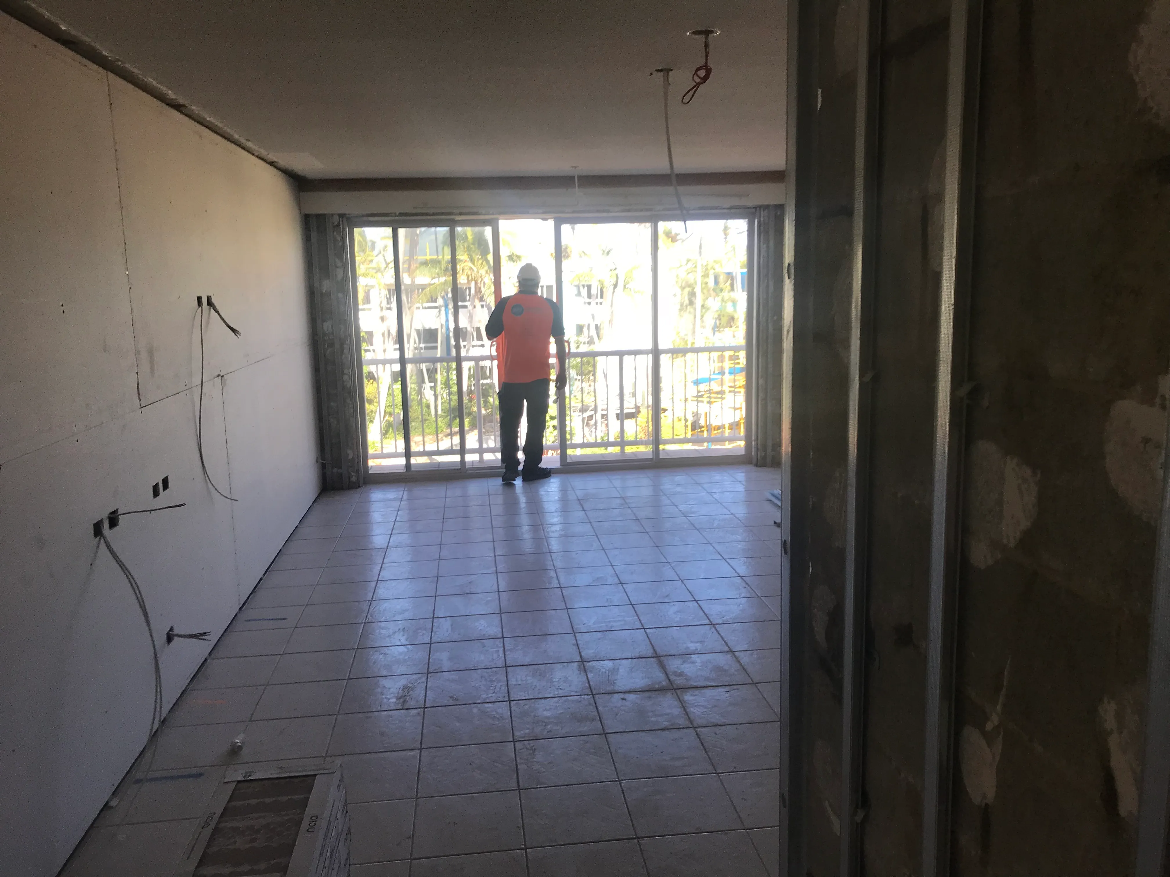 Daydream Island resort room stripped to bare walls during reconstruction — exposed cables, no fittings, pre-ICT fit-out.
